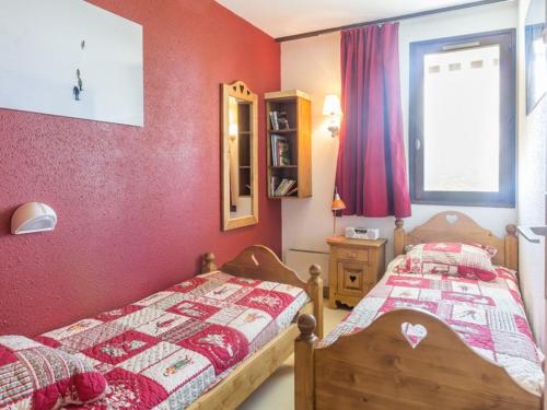 a bedroom with two beds and a window at Appartement La Rosière, 2 pièces, 4 personnes - FR-1-275-86 in La Rosière