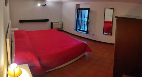 Un pat sau paturi într-o cameră la IL VICOLETTO