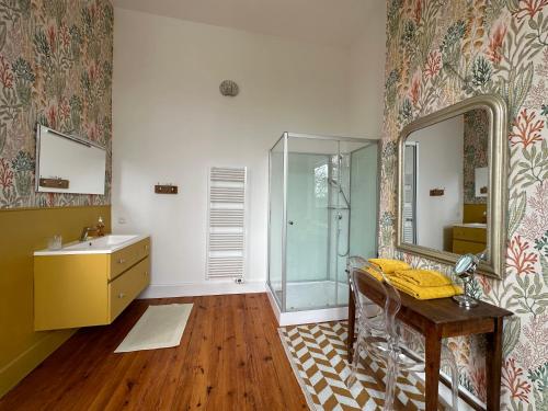 a bathroom with a sink and a mirror at Château Guirotte in Moncaut