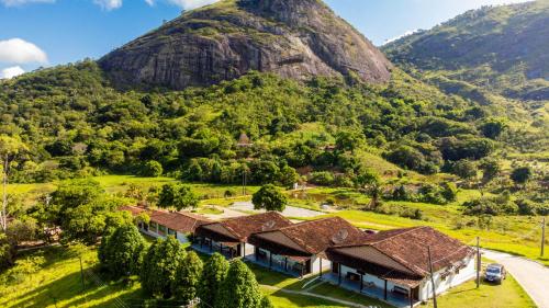 an aerial view of a resort with a mountain in the background at EcoFlat Moderno e Aconchegante in Bonito