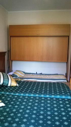 Ένα ή περισσότερα κρεβάτια σε δωμάτιο στο Hotel Jean Marie
