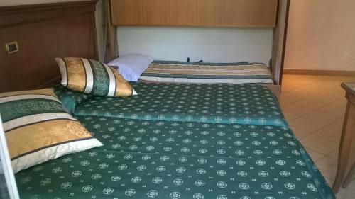 Ένα ή περισσότερα κρεβάτια σε δωμάτιο στο Hotel Jean Marie