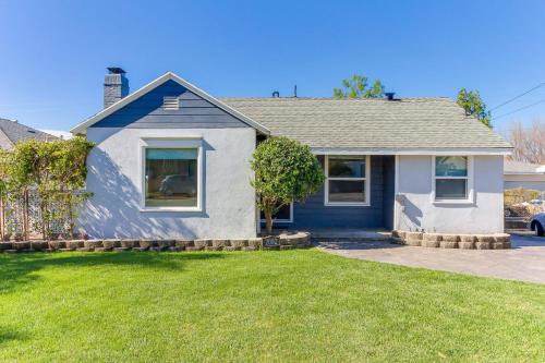 a blue house with a lawn in front of it at San Fernando Pool home + Large Private Guest House in San Fernando