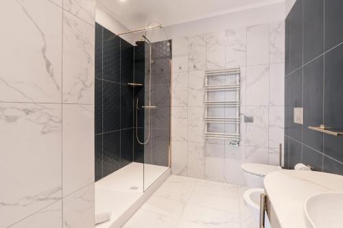 a bathroom with a shower and a toilet at Be Mate Castel Sant'Angelo in Rome