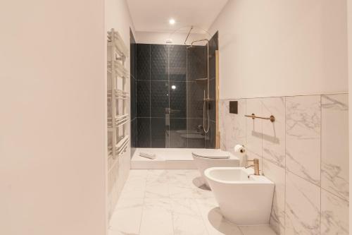 a bathroom with a toilet and a sink and a shower at Be Mate Castel Sant'Angelo in Rome