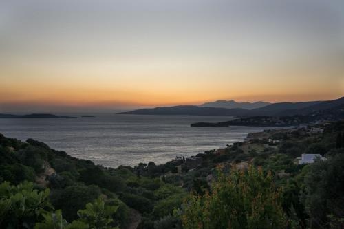 a view of the ocean at sunset at The Antique House in Batsi
