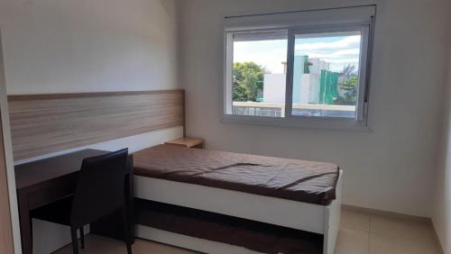 Ліжко або ліжка в номері Apartamento Areias Brancas - 202
