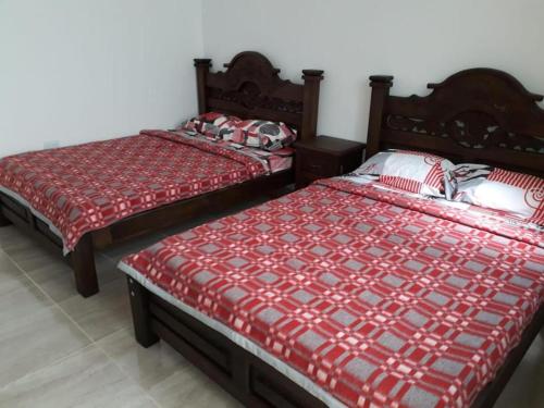 Katil atau katil-katil dalam bilik di Cabaña y apartamentos
