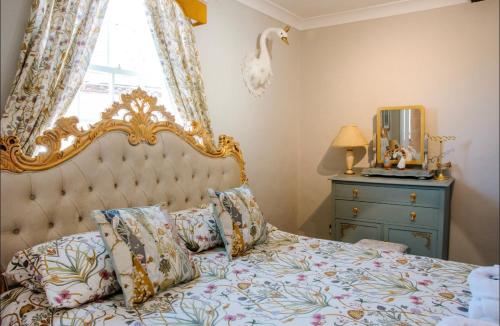 a bedroom with a bed and a window and a dresser at Whispering Place Georgian Grade II Sleeps 6 Adults 3 mins from Safari Park & Steam Train in Bewdley