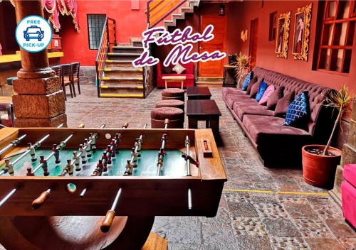 a ping pong table in a room with a pool table at Union Hotel Cusco in Cusco