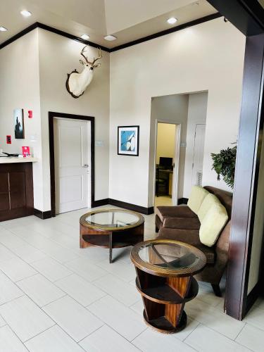 a living room with a couch and a table at Lonestar Inn in El Campo