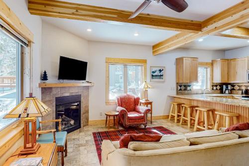 a living room with a couch and a fireplace at Wallowa Lake Wonder in Joseph