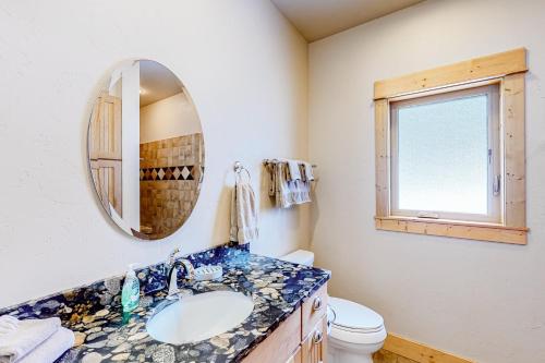 a bathroom with a sink and a mirror at Wallowa Lake Wonder in Joseph