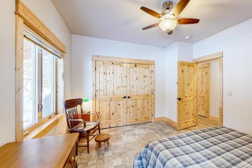 a bedroom with a bed and a ceiling fan at Wallowa Lake Wonder in Joseph
