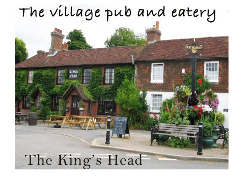 a pub with a sign in front of a building at The Guest Suite, Buttsfield Lane. in East Hoathly