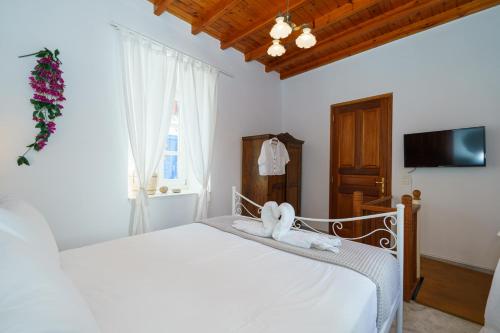Postel nebo postele na pokoji v ubytování Captain D - Hydra Dream Houses