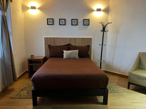 Ένα ή περισσότερα κρεβάτια σε δωμάτιο στο Hotel San Sebastian