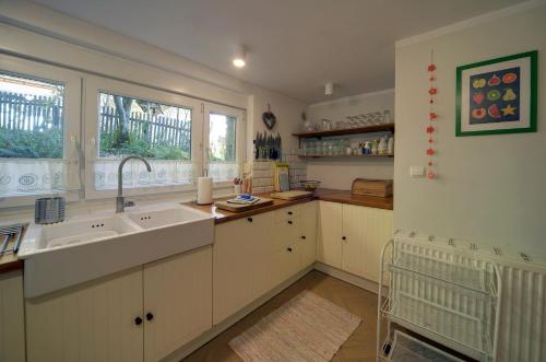 a kitchen with a sink and a window at Widokówka Karkonoska in Szklarska Poręba