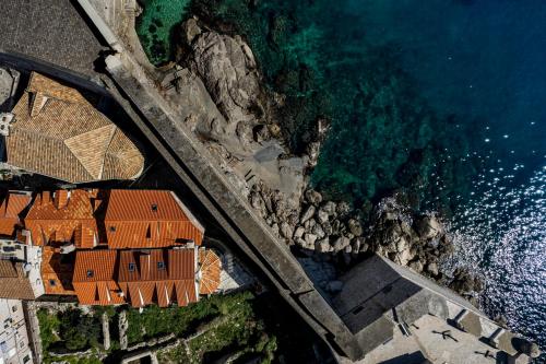an aerial view of a house next to the ocean at Stayeva 11 in Dubrovnik