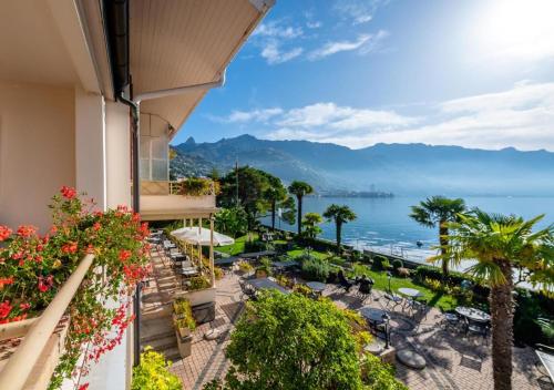 a balcony of a hotel with a view of the ocean at JETTY Montreux in Montreux