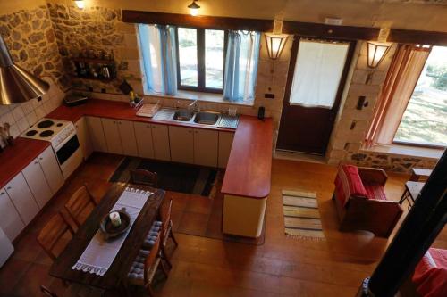 an overhead view of a kitchen and living room at Elpida Country House -Paleochora-Anidri in Palaiochora