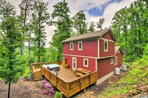 a red tiny house with a large deck at Mountain View Boone Home Close to Blue Ridge Pkwy! in Blowing Rock