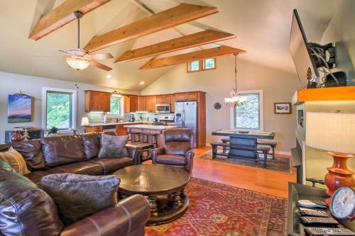 a living room with leather furniture and a table at Mountain View Boone Home Close to Blue Ridge Pkwy! in Blowing Rock