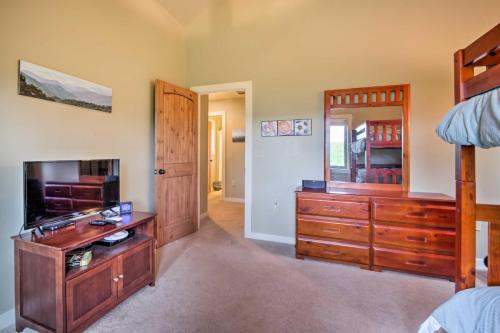 a bedroom with a bed and a dresser and a mirror at Mountain View Boone Home Close to Blue Ridge Pkwy! in Blowing Rock