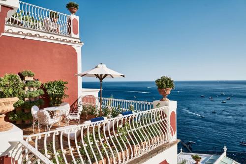 a balcony of a building with a view of the ocean at Le Sirenuse in Positano