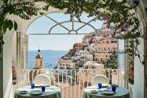 a restaurant with a view of the city at Le Sirenuse in Positano
