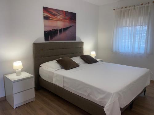 Ένα ή περισσότερα κρεβάτια σε δωμάτιο στο Apartmani Vera