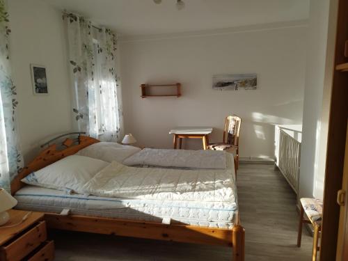 a bedroom with a large bed in a room at Haus Sandra Ferienwohnung 2 in Dahme