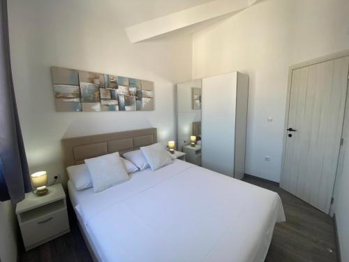 Ένα ή περισσότερα κρεβάτια σε δωμάτιο στο Apartmani Vera