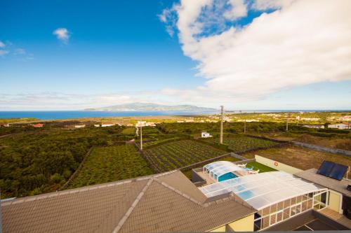 an aerial view of a house with the ocean in the background at AL Novavista by A5P in Madalena