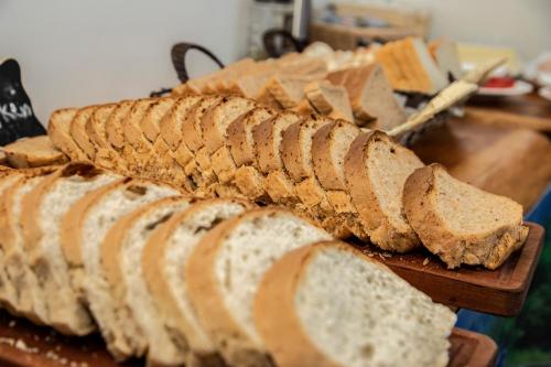 a pile of sliced bread on a cutting board at Hotel Cumbres del Sur in Pucón