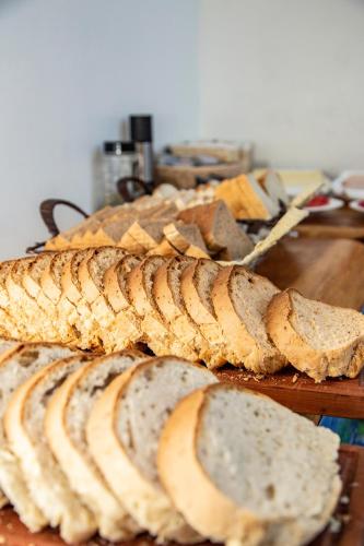 a group of slices of bread on a wooden table at Hotel Cumbres del Sur in Pucón