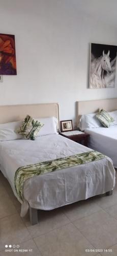 Ein Bett oder Betten in einem Zimmer der Unterkunft Hospedaje Familiar