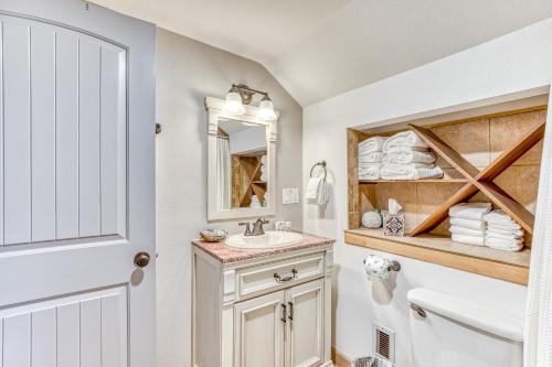 a bathroom with a sink and a mirror at A Slice Above in Lincoln City