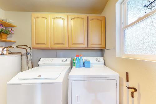 a laundry room with a washer and dryer at Cedar River Retreat in Renton