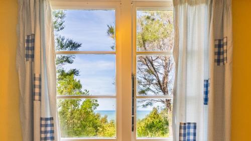 a window with a view of the ocean at Ao Marama Retreat in Collingwood