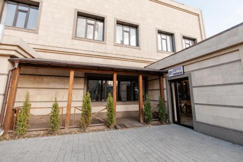 a building with a entrance to a building at 281 Hostel in Bishkek