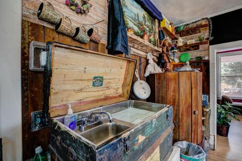 a kitchen with a sink and a wooden wall at The Oasis on Eisenhower in Loveland