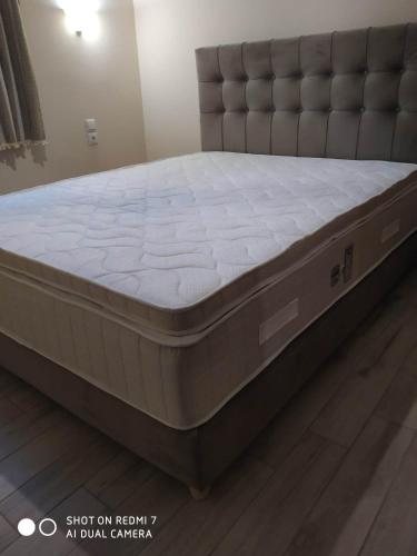 a mattress sitting on the floor in a room at Menelaos Apartments in Lefokastro