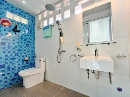 a bathroom with a toilet and a sink at Estrella Ba Vì Villas - Venuestay in Ba Vì