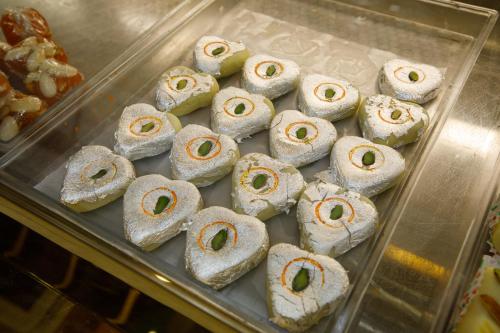 a tray of pastries in a display case at Sangam City Hotel Pure Veg in Kathmandu