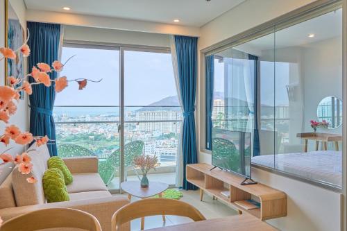 a living room with a view of a city at T-Plantino - Căn hộ Codotel The Sóng 5 Sao - Free swimmingpool, Gym, Sauna in Vung Tau