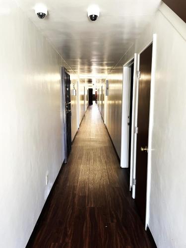 a hallway of an office building with a long corridor at Lido Hotel in Huntington Park