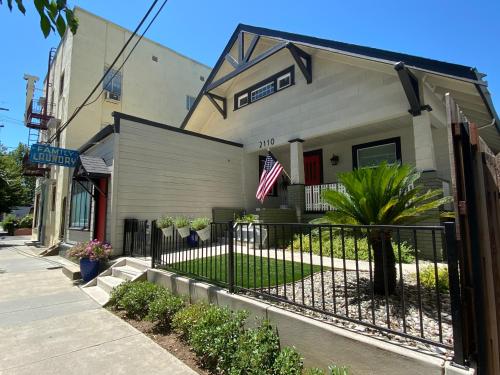 a house with a fence in front of it at Family Laundry & Spa in Sacramento