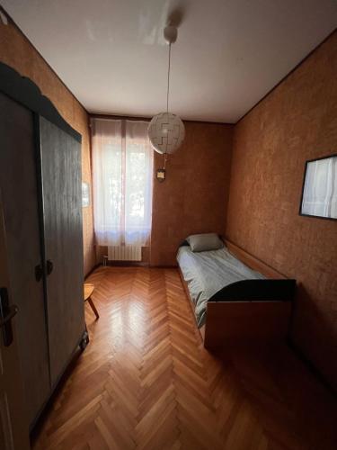 a small bedroom with a bed and a window at 45°-13° Nord Est in Trieste