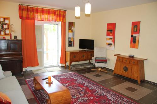 a living room with a couch and a table at Vila Dětenice in Dětenice